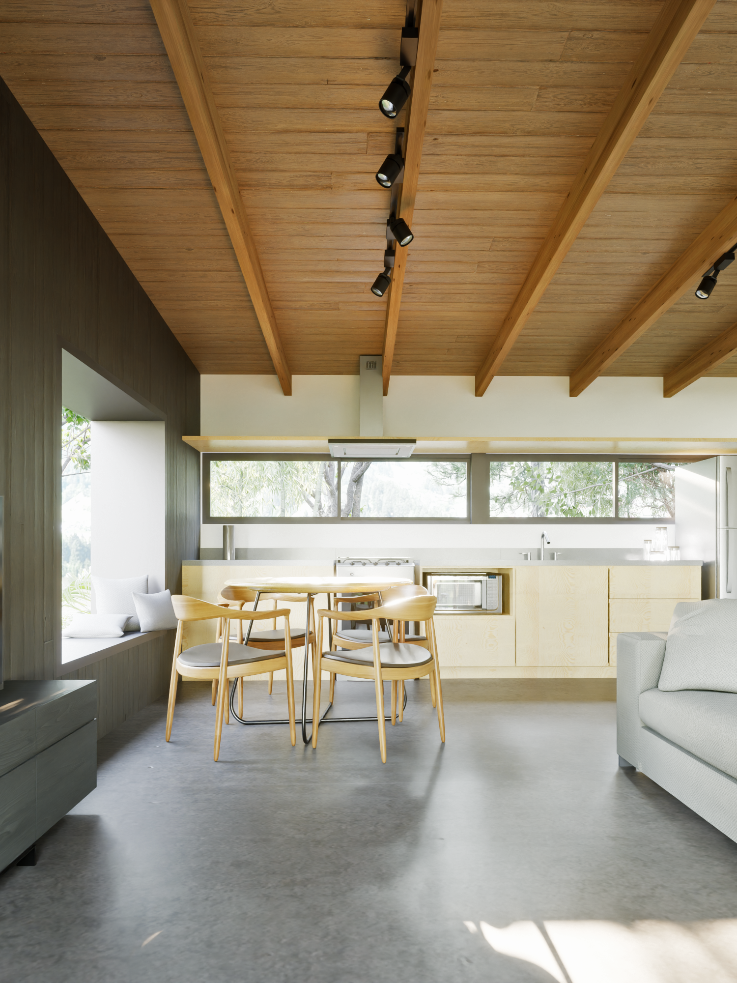 Imagem do interior de uma casa em revestimento de madeira em dois tons, com a parede dos armários da cozinha ao fundo. Podemos ver as instalações dos projetos complementares, como as hidrossanitárias, elétricas e luminárias. Na imagem também é possível ver uma mesa em madeira com quatro cadeiras junto a janela, um pedaço de sofá